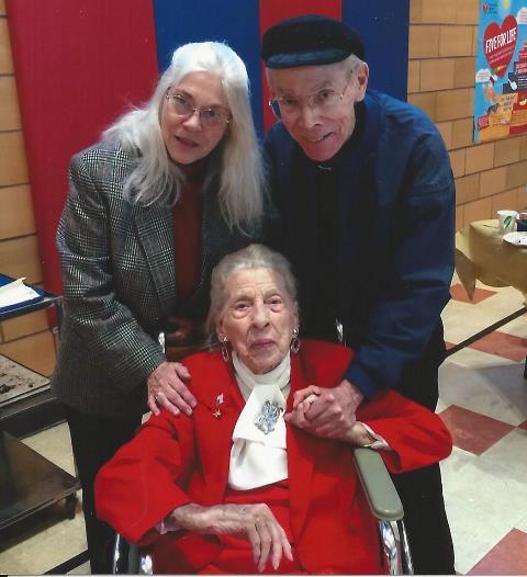 Queen Esther with friends at a reception after a special Mass celebrating her 100th birthday.