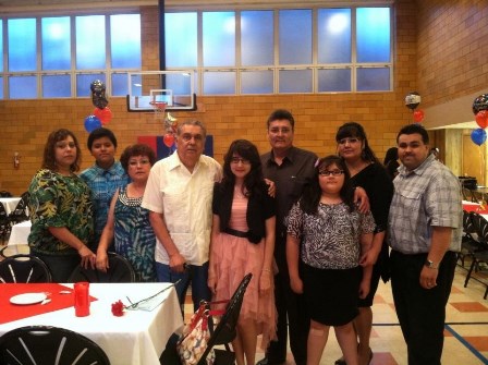 Miss Elizabeth and her extended family gather for a photograph celebrating her graduation from Saint Frances Cabrini Academy in Saint Louis, Missouri.