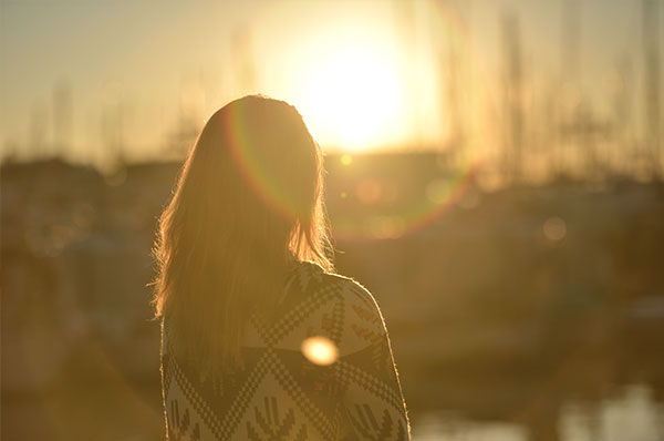 In this photograph, filled with the Light of Christ, a young lady ponders her vocation.